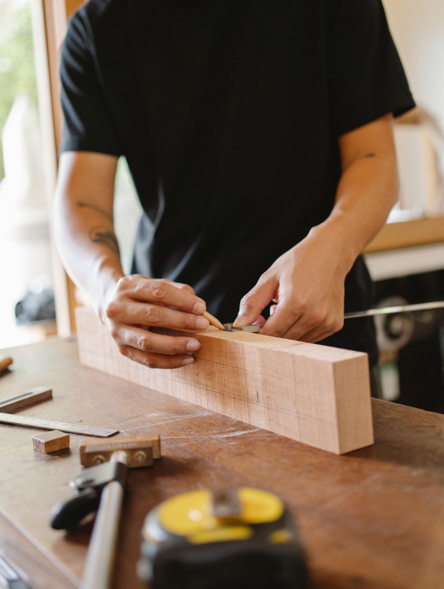 Master craftsman shaping timber by hand